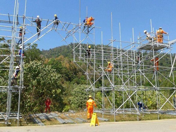 Scaffolding in construction with workers using steel and bamboo scaffolds safely